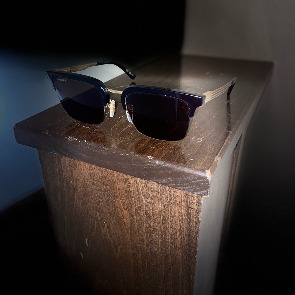 Gucci Black Frame Sunglasses with Gold Detail